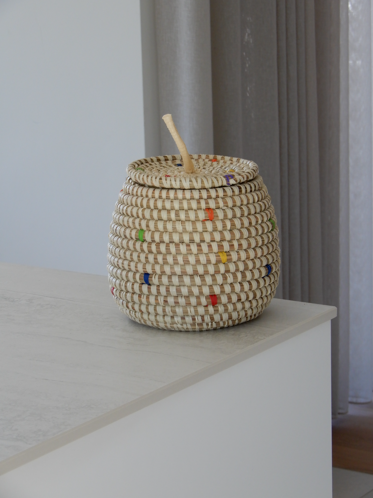 Basket with coloured dot pattern